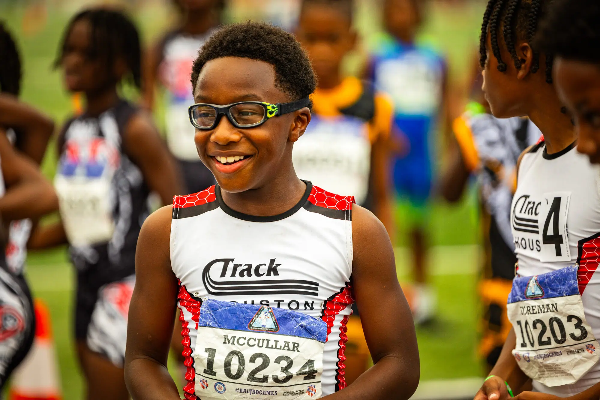 A smiling Track Houston athlete after competition.