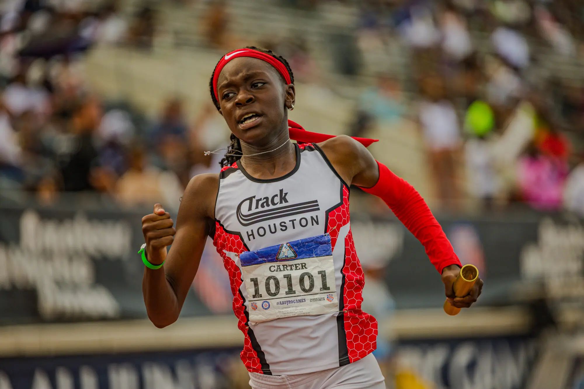 A determined Track Houston relay runner powers down the straight at nationals.