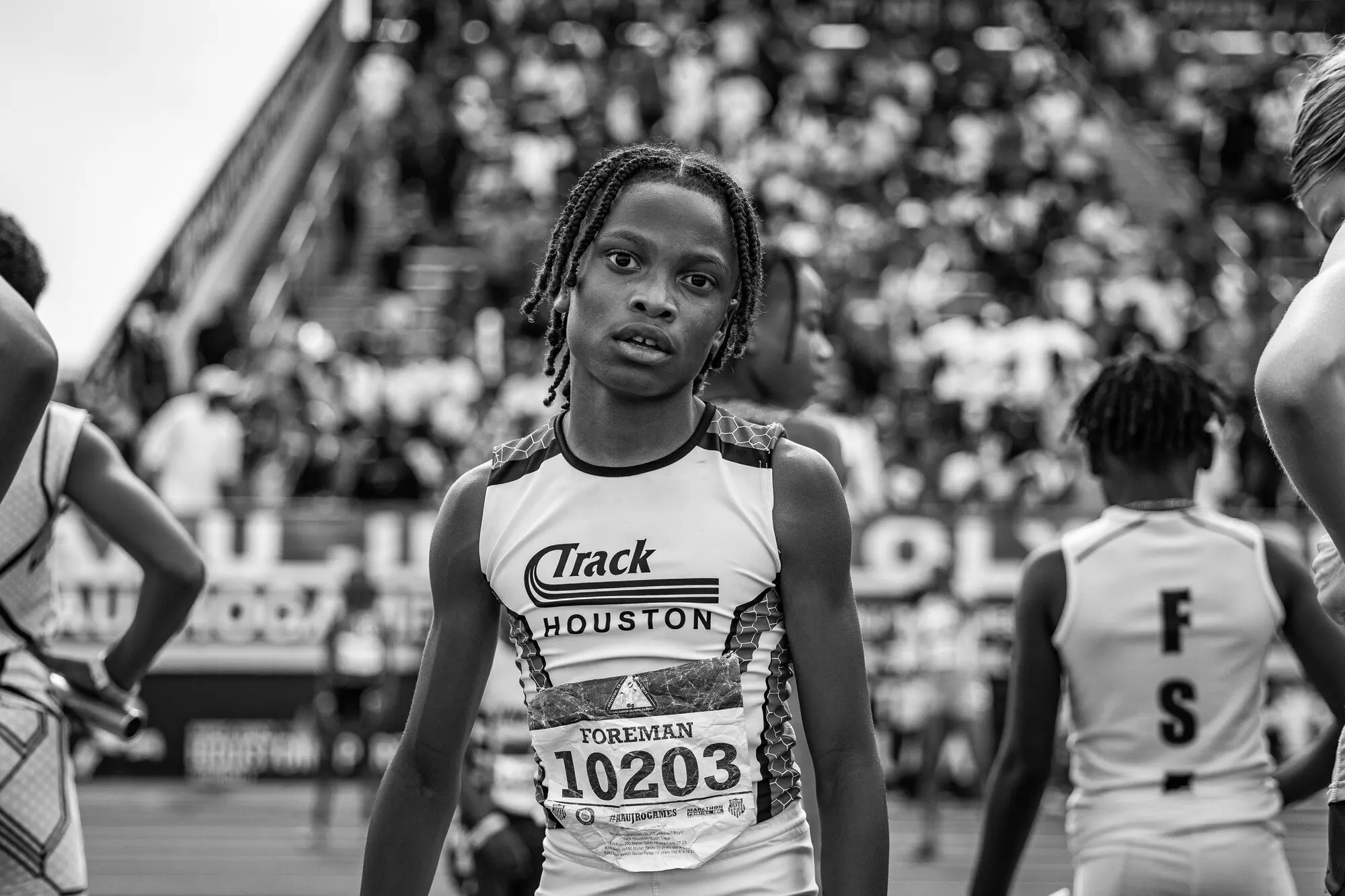 Black-and-white portrait of a young Track Houston athlete before his race at nationals.