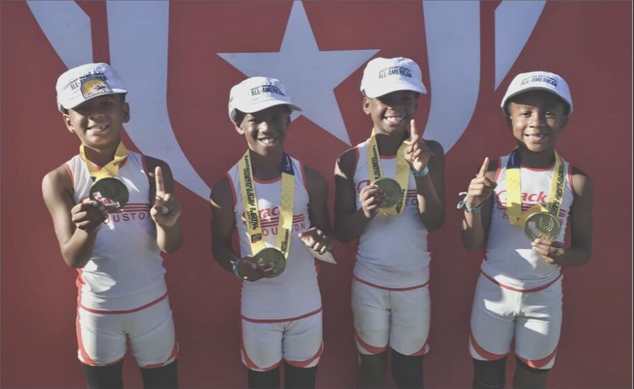 8U Boys 4x100m relay on the podium at the 2026 National Junior Olympics