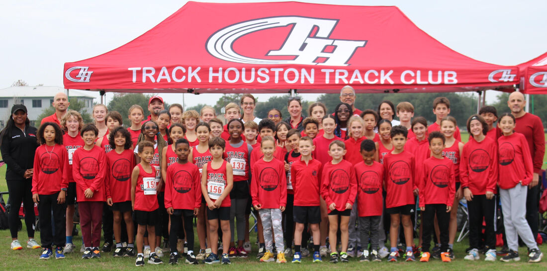 The Track Houston cross country team gathered under the club tent.